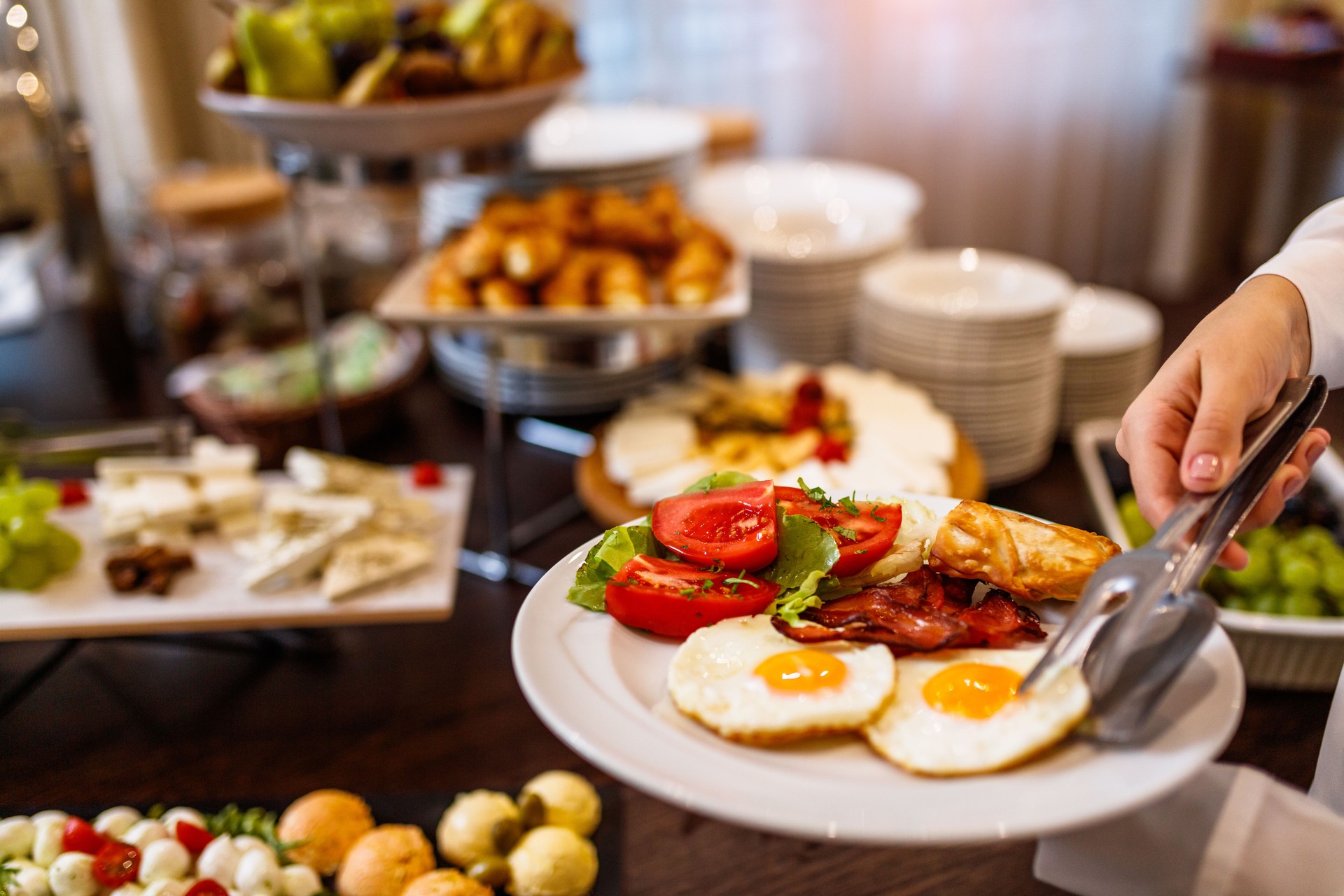 Choosing breakfast at restaurant buffet